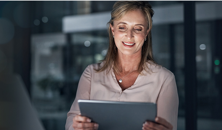 Women looking at mobile with smiling face