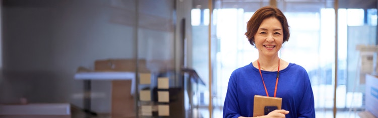 people in a meeting looking at laptop