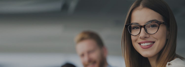 woman in glasses smiling