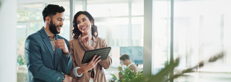 employees looking at a laptop