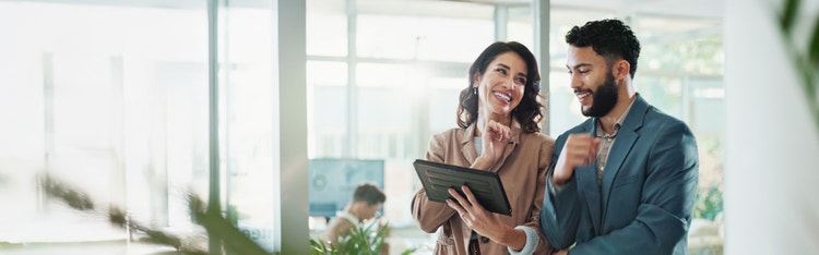employees looking at a laptop