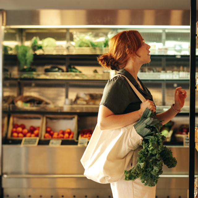 A woman having grocery shopping. Find out what employee benefits you can package through Maxxia depending on your industry.