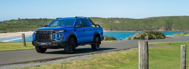 JAC T9 exterior front view on a hill road available on a novated lease in Australia through Maxxia.