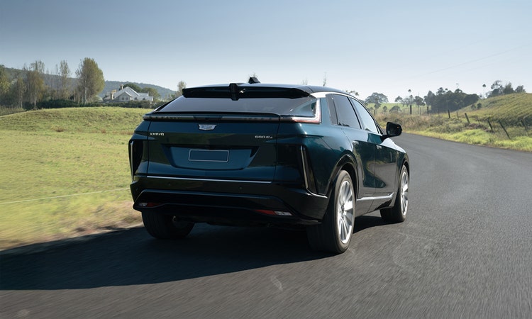 CADILLAC LYRIQ exterior front view on a hill road available on a novated lease in Australia through Maxxia.
