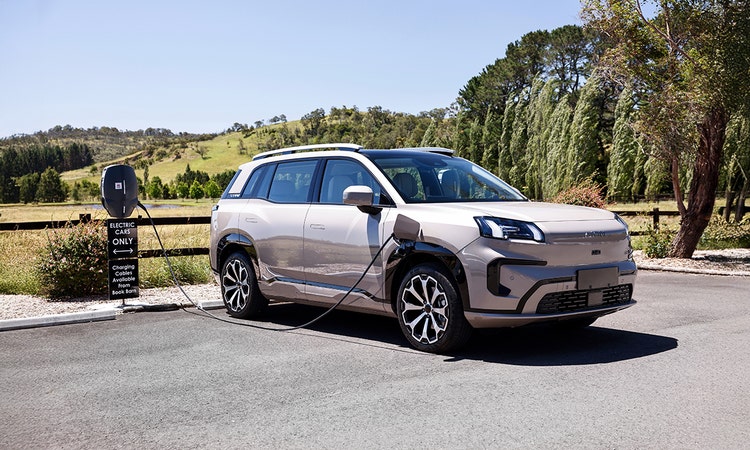 GAC AION exterior front view on a hill road available on a novated lease in Australia through Maxxia.