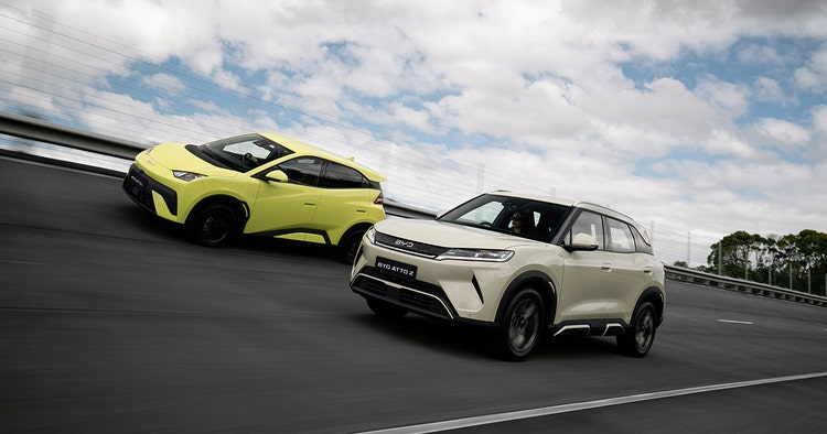 BYD ATTO exterior front view on a highway. Contact Maxxia for BYD ATTO novated lease today.