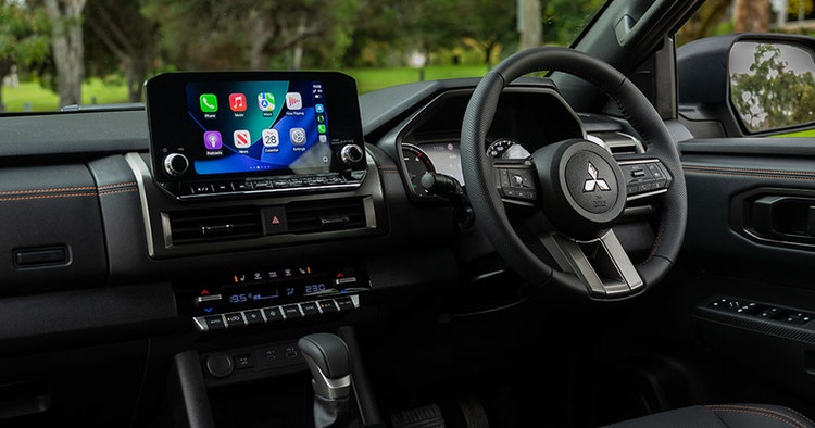 Mitsubishi Triton ute interior dashboard view available on a novated lease through Maxxia in Australia.