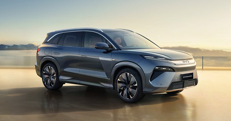 BYD ATTO exterior front view on a highway. Contact Maxxia for BYD ATTO novated lease today.