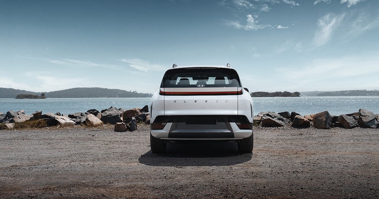 Toyota HiLux exterior front view on a highway. Contact Maxxia for Toyota HiLux novated lease today.