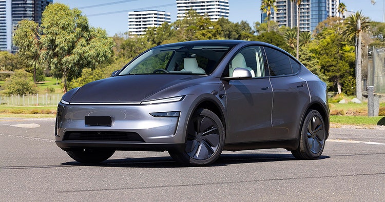 Tesla Model 3 exterior front view on a highway. Contact Maxxia for Tesla Model 3 novated lease today.