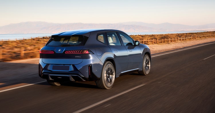 BMW iX3 rear exterior view on the coastline, novate an BMW iX3 through Maxxia. Contact Maxxia novated leasing team today.