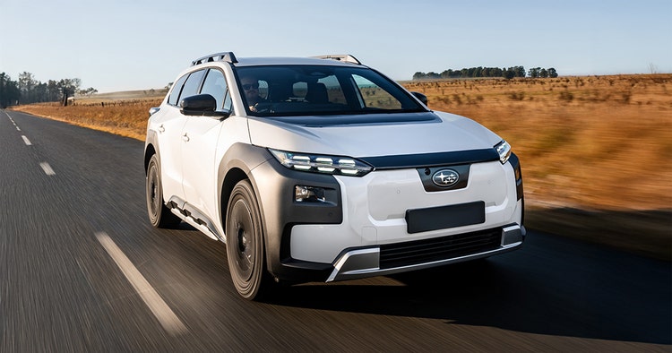 Subaru Trailseeker front exterior view towing a caravan on the beach available for a novated lease with Maxxia.