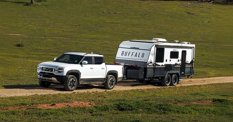 BYD SHARK 6 front exterior view towing a caravan on the beach available for a novated lease with Maxxia.