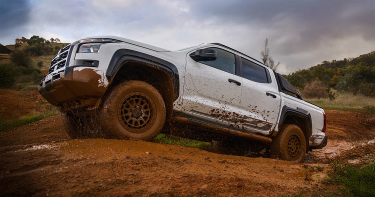 Mitsubishi Triton side exterior view on the beach available for a novated lease with Maxxia.