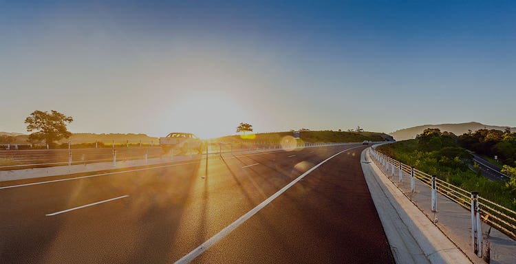 Girl waving from car - novated leasing by maxxia