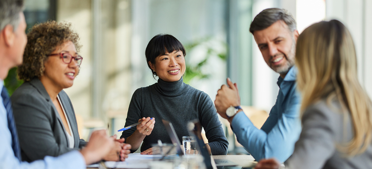 co-workers chatting around a table