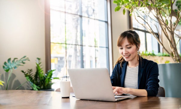 A woman working on a computer.
