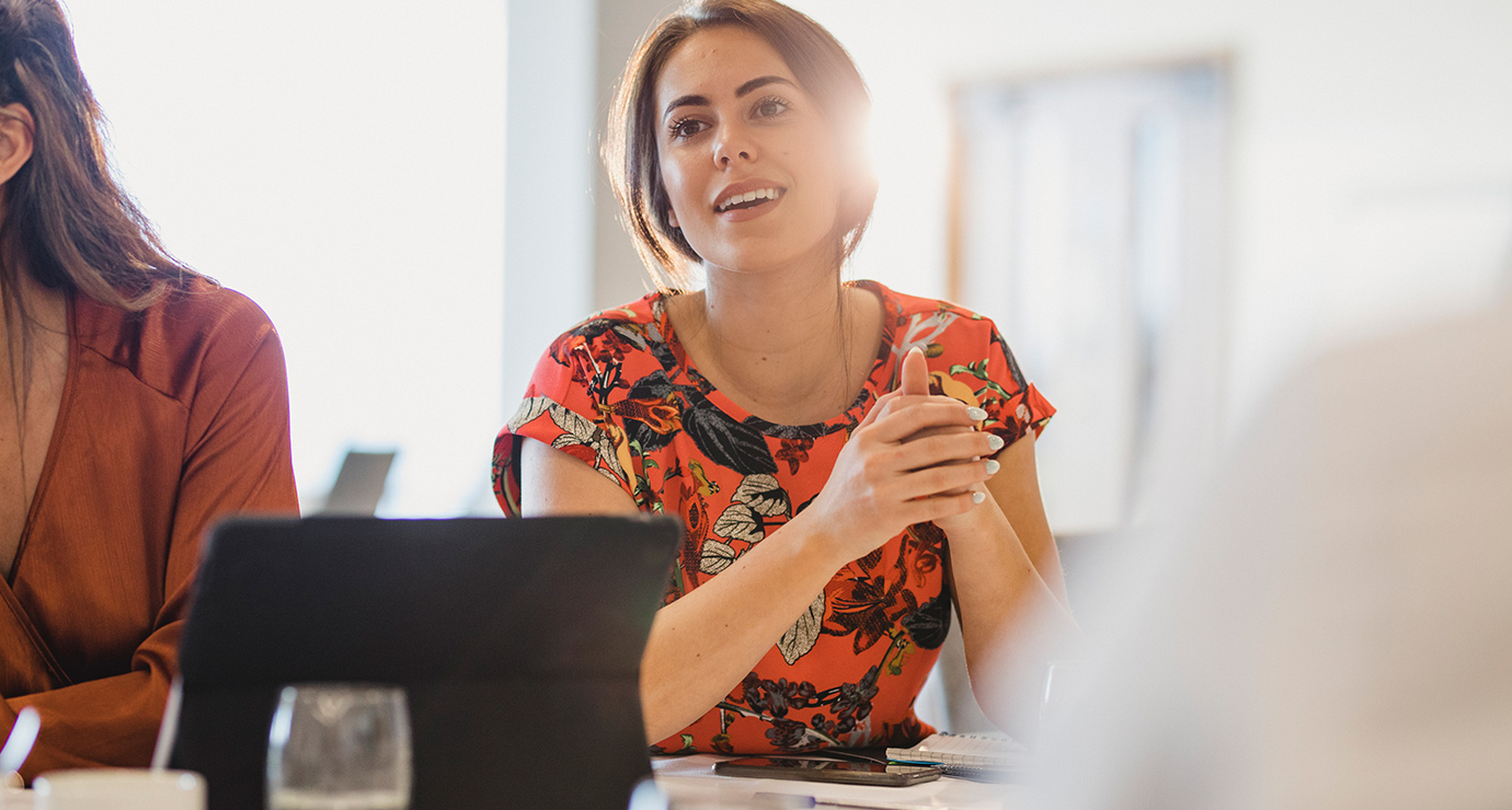 A woman listening to salary packaging benefit discussion. 