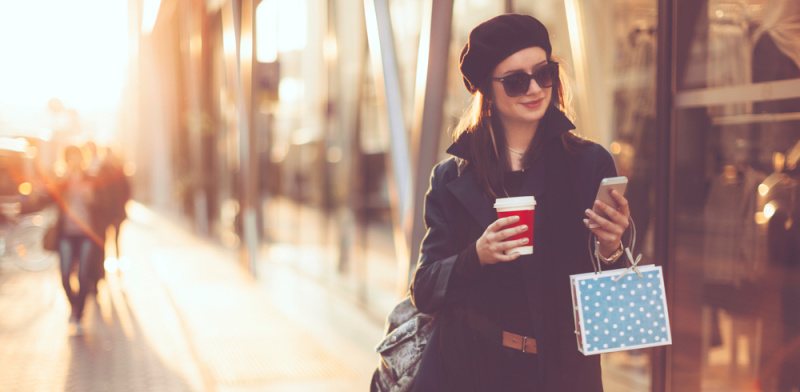 woman walking looking at phone