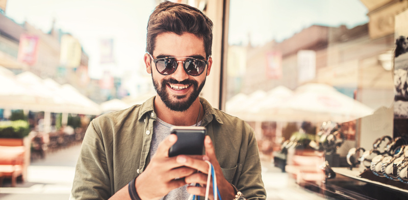 man looking at phone