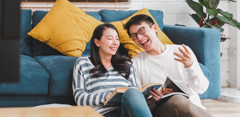 Lifestyle Asian couple man and woman talking working spend time together at home