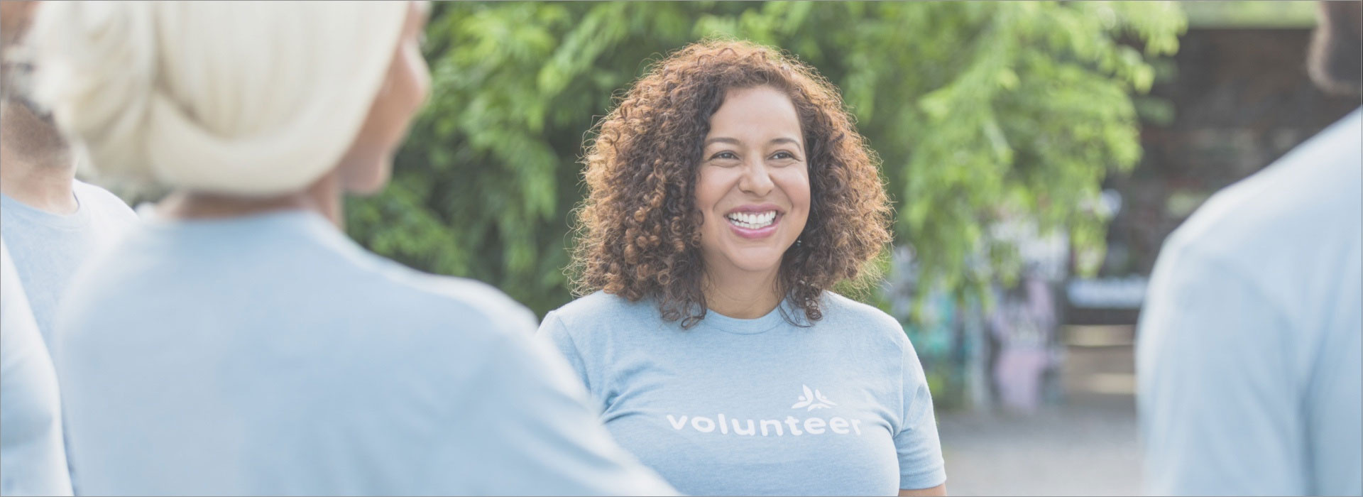 woman smiling at a charity event