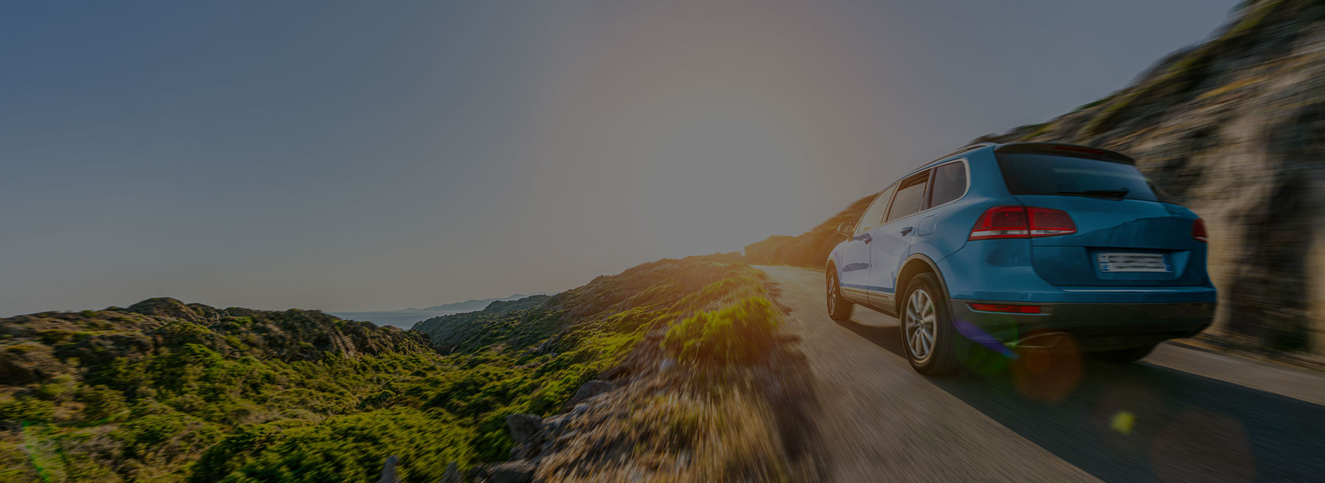 Car driving on coastal road