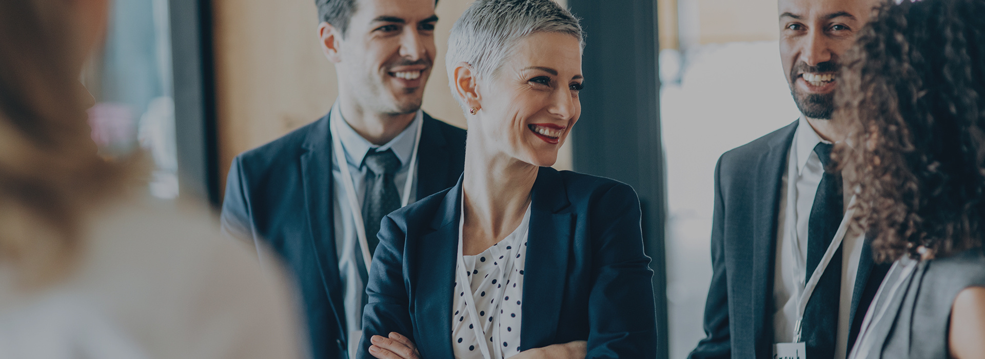 A woman chatting with her colleagues at work.