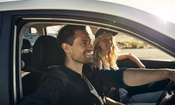 Australian couple driving in car