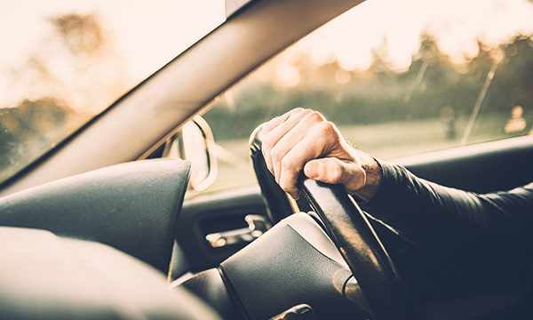 hand on steering wheel