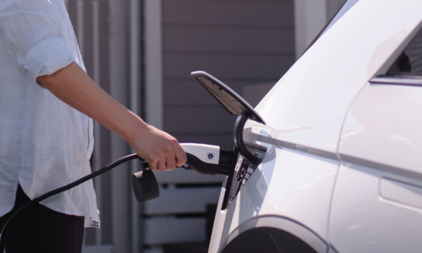 A woman charging her car