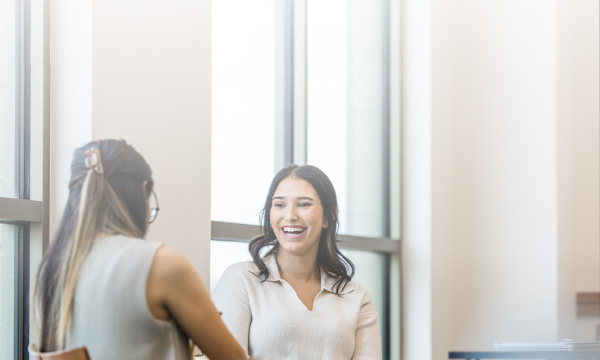 women talking in office