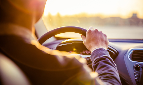 hand on steering wheel