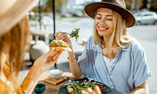 Friends enjoying a meal at a cafe